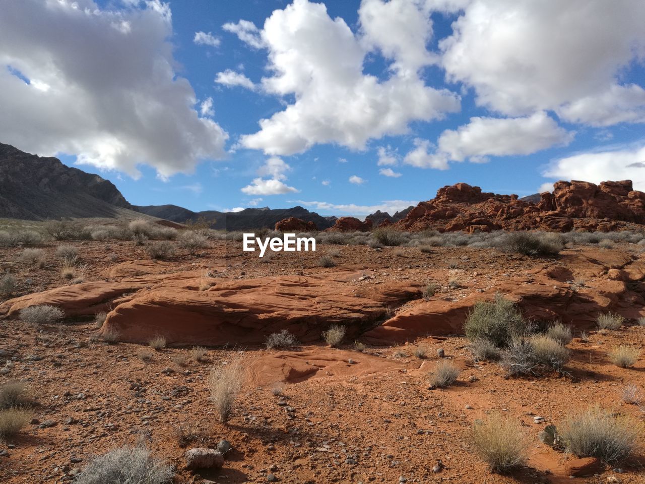 Scenic view of mountains against cloudy sky