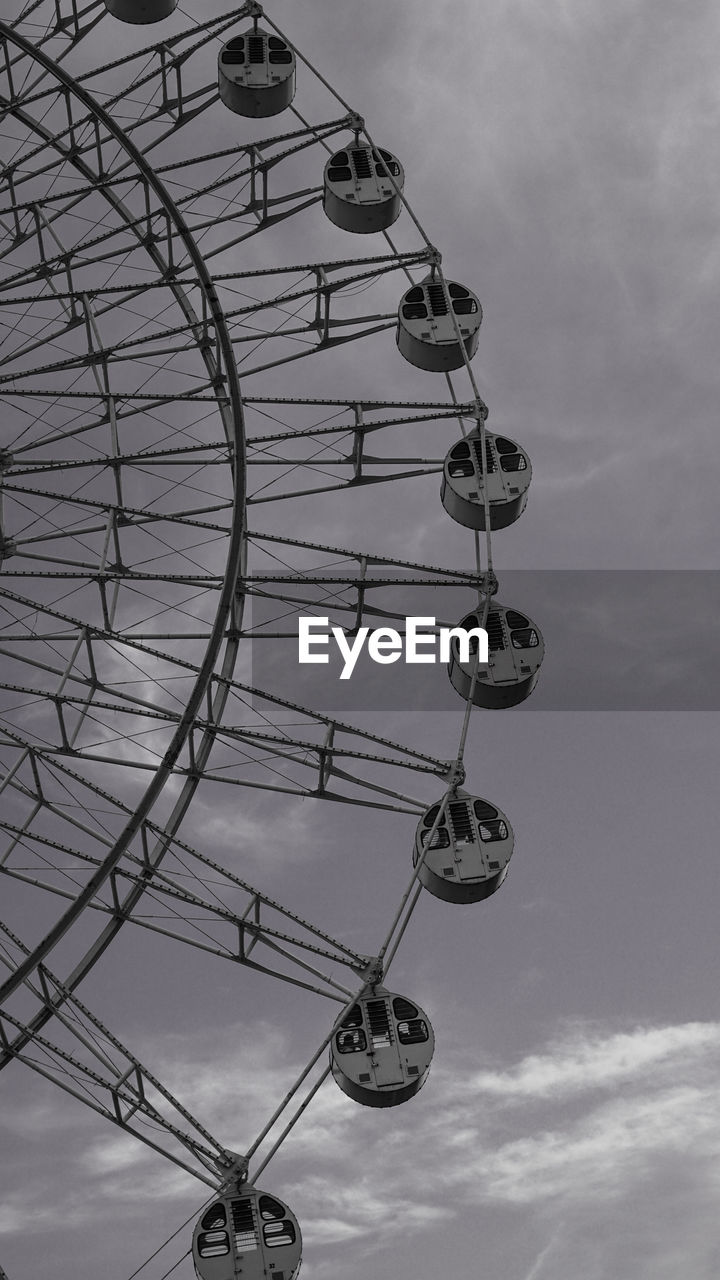 LOW ANGLE VIEW OF ROLLERCOASTER AGAINST SKY