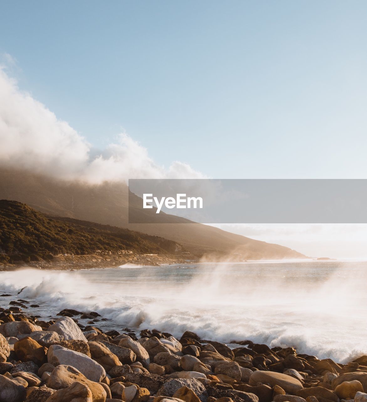 Scenic view of waterfall against sky