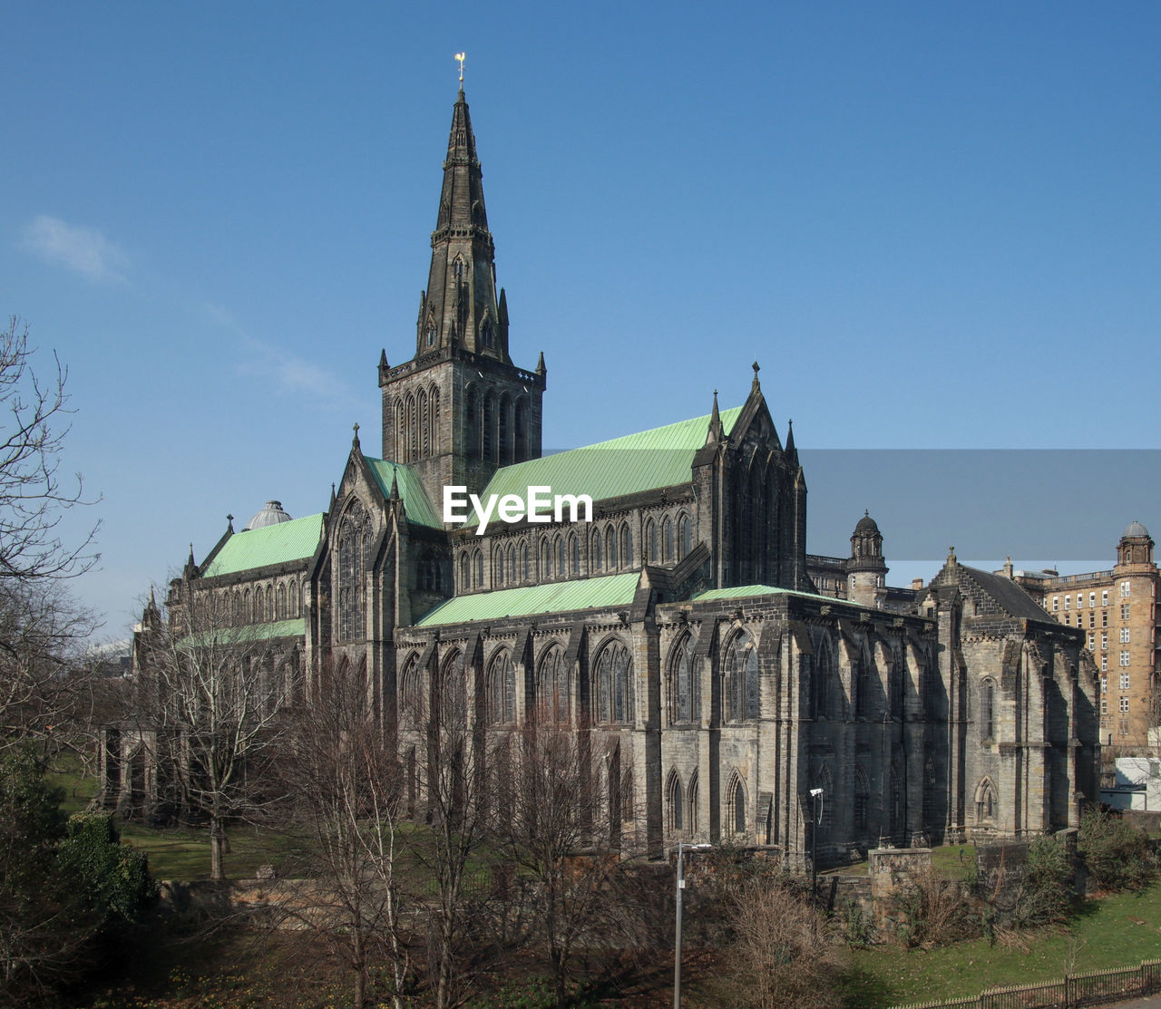 architecture, built structure, sky, building exterior, place of worship, travel destinations, building, religion, nature, history, landmark, worship, the past, clear sky, travel, belief, blue, no people, spirituality, plant, tree, tower, day, spire, tourism, sunny, city, outdoors, château, catholicism, old