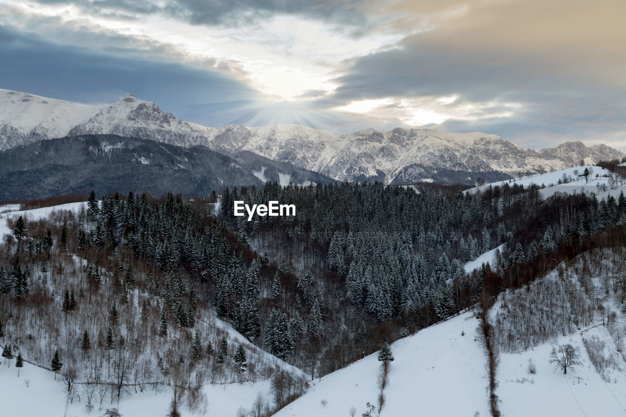 Scenic view of snowcapped mountains against sky