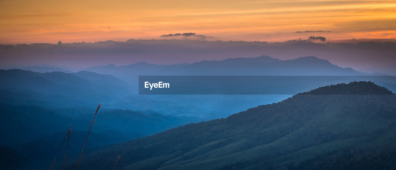 Scenic view of mountains against sky during sunset