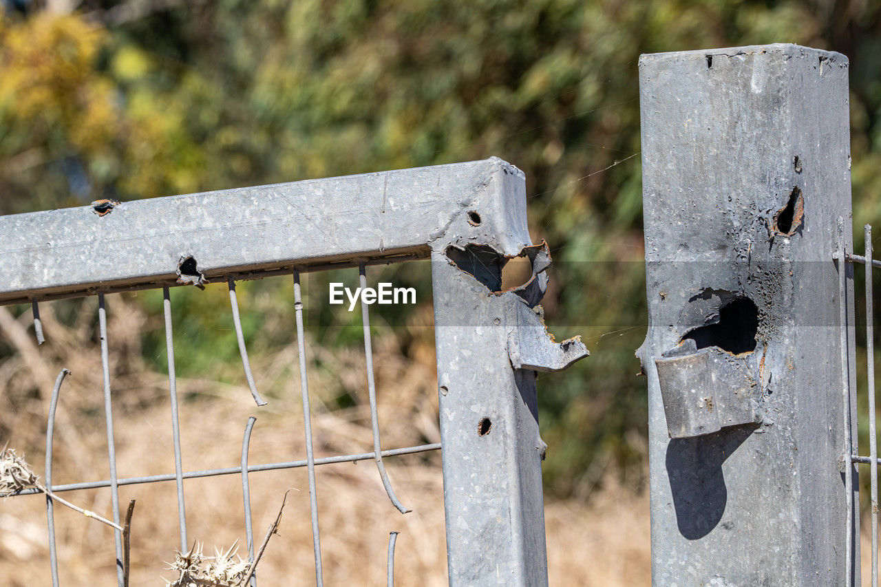 focus on foreground, no people, metal, day, nature, wood, fence, protection, outdoors, security, iron, close-up, sunlight