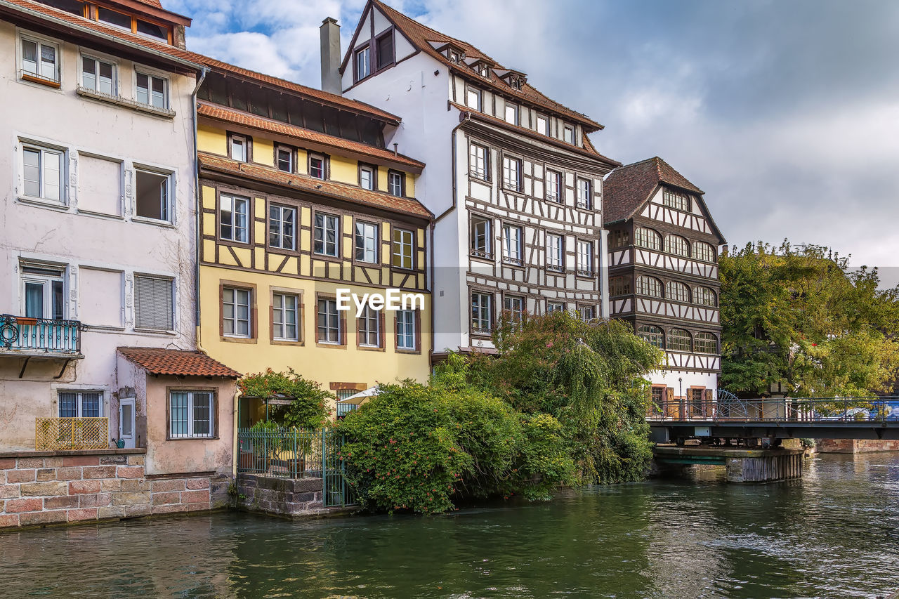 Historic houses on the embankment of the ill river in petite france district in strasbourg, france