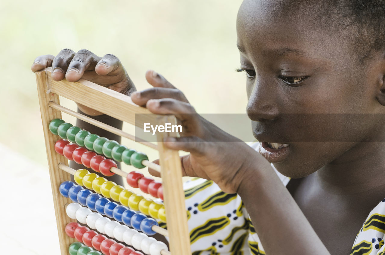 Close-up of girl with abacus