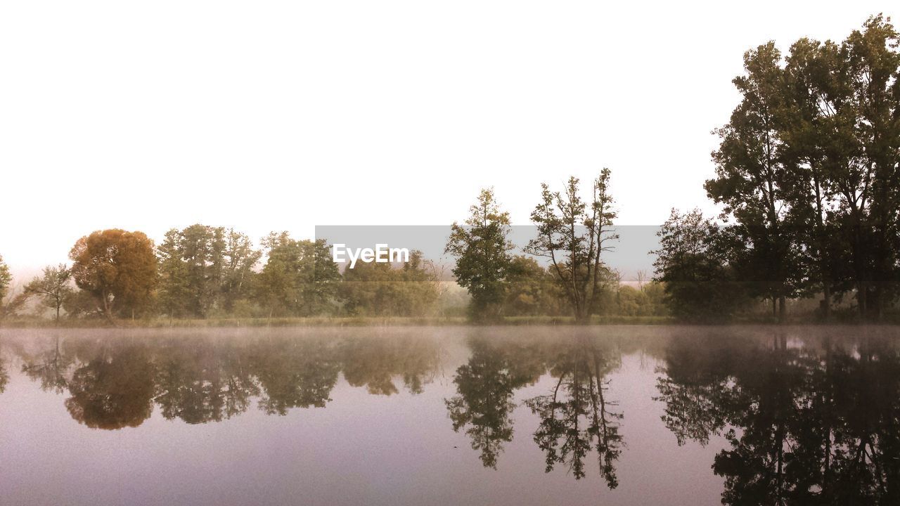 Scenic view of calm lake against clear sky