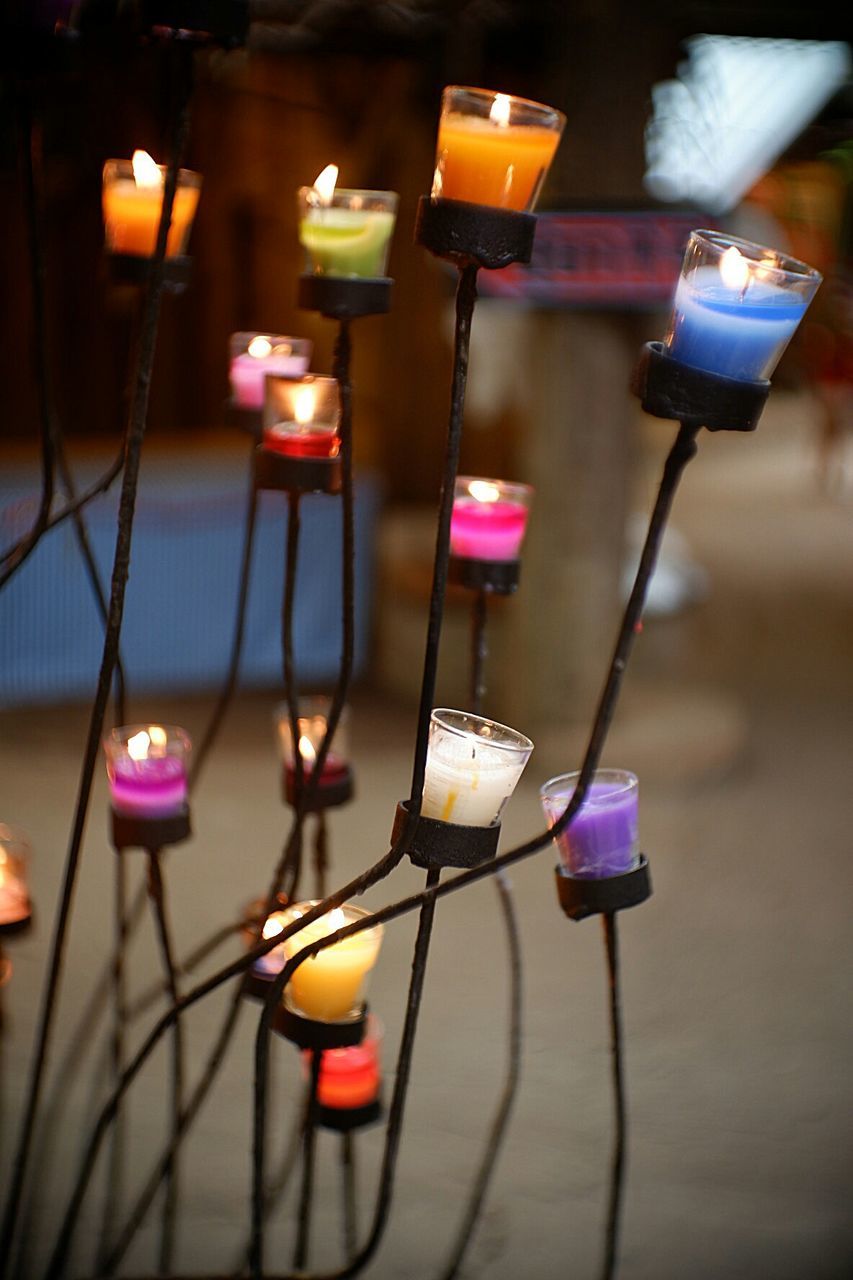 Close-up of illuminated candles at night