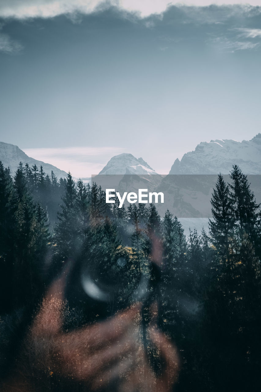 Snowcapped mountains seen through window