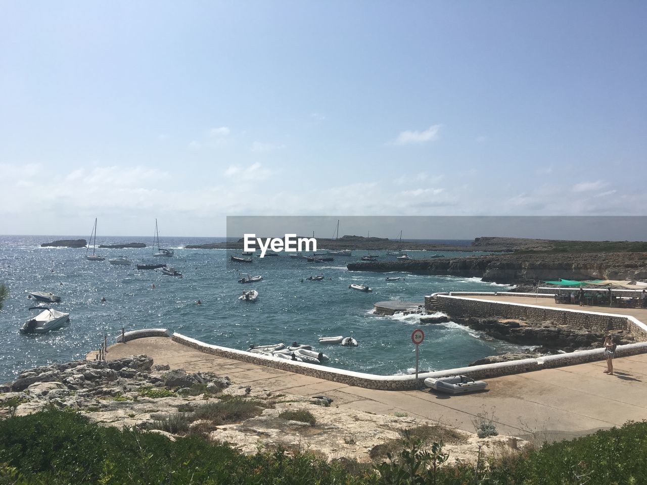 A small village port of binebeca in menorca on a sunny day