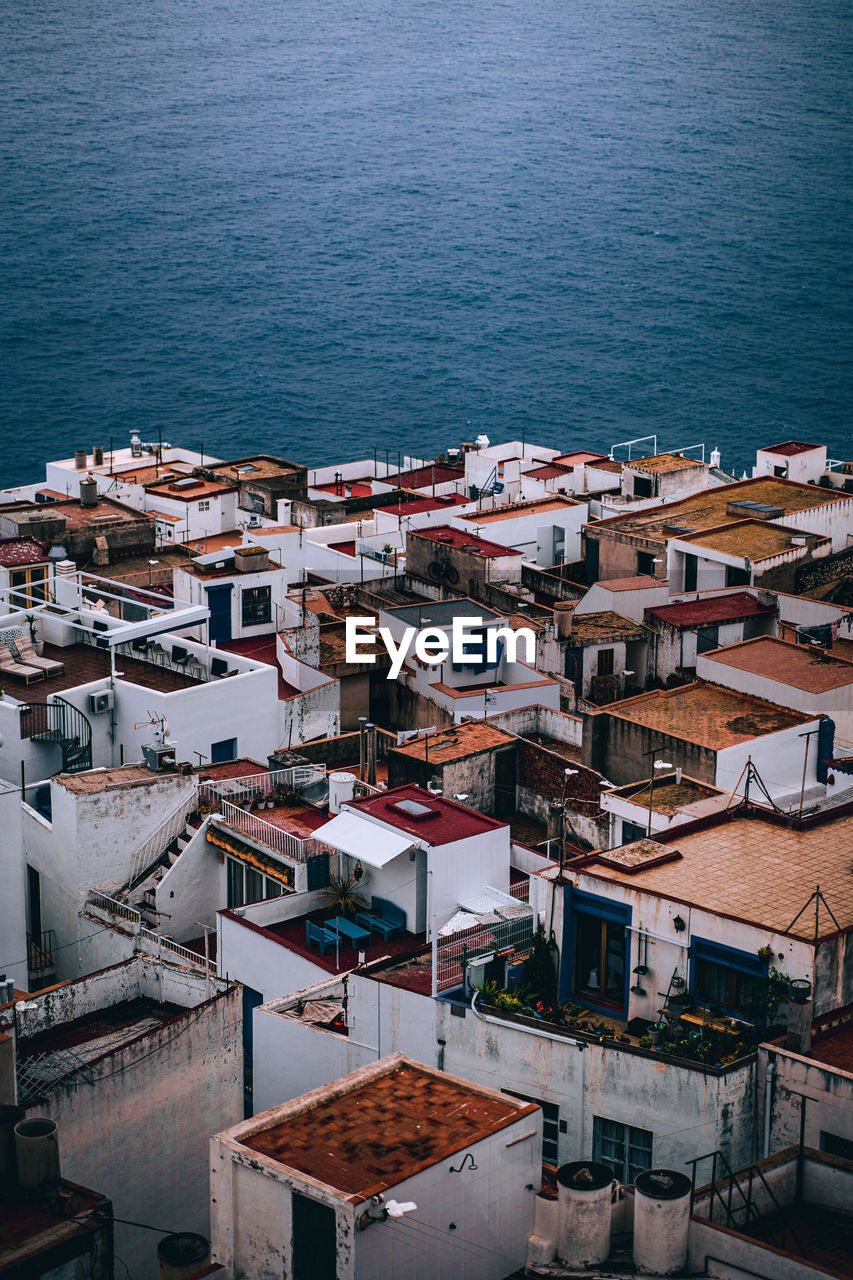 High angle view of mediterranean townscape by sea