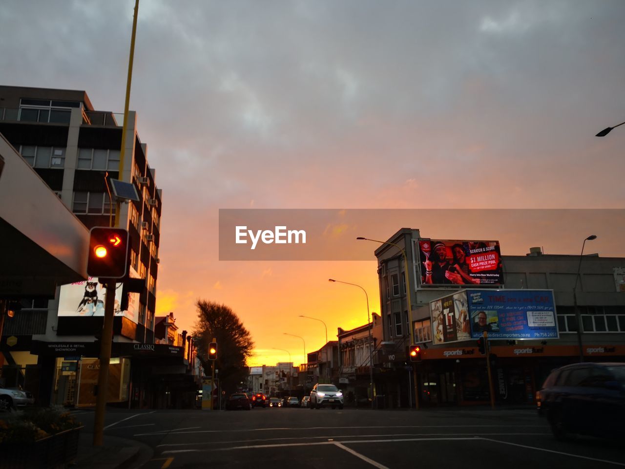 CARS ON ROAD AT DUSK