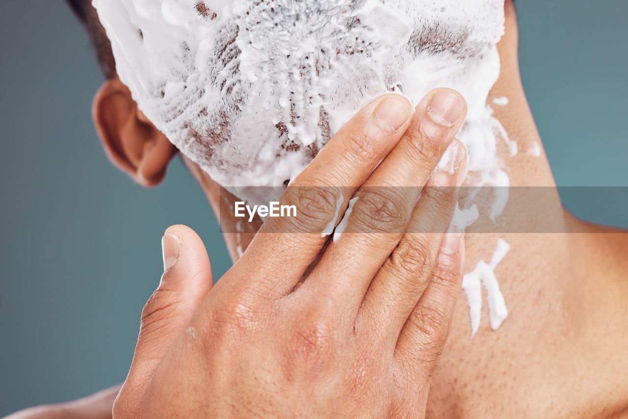 cropped hand of woman holding water