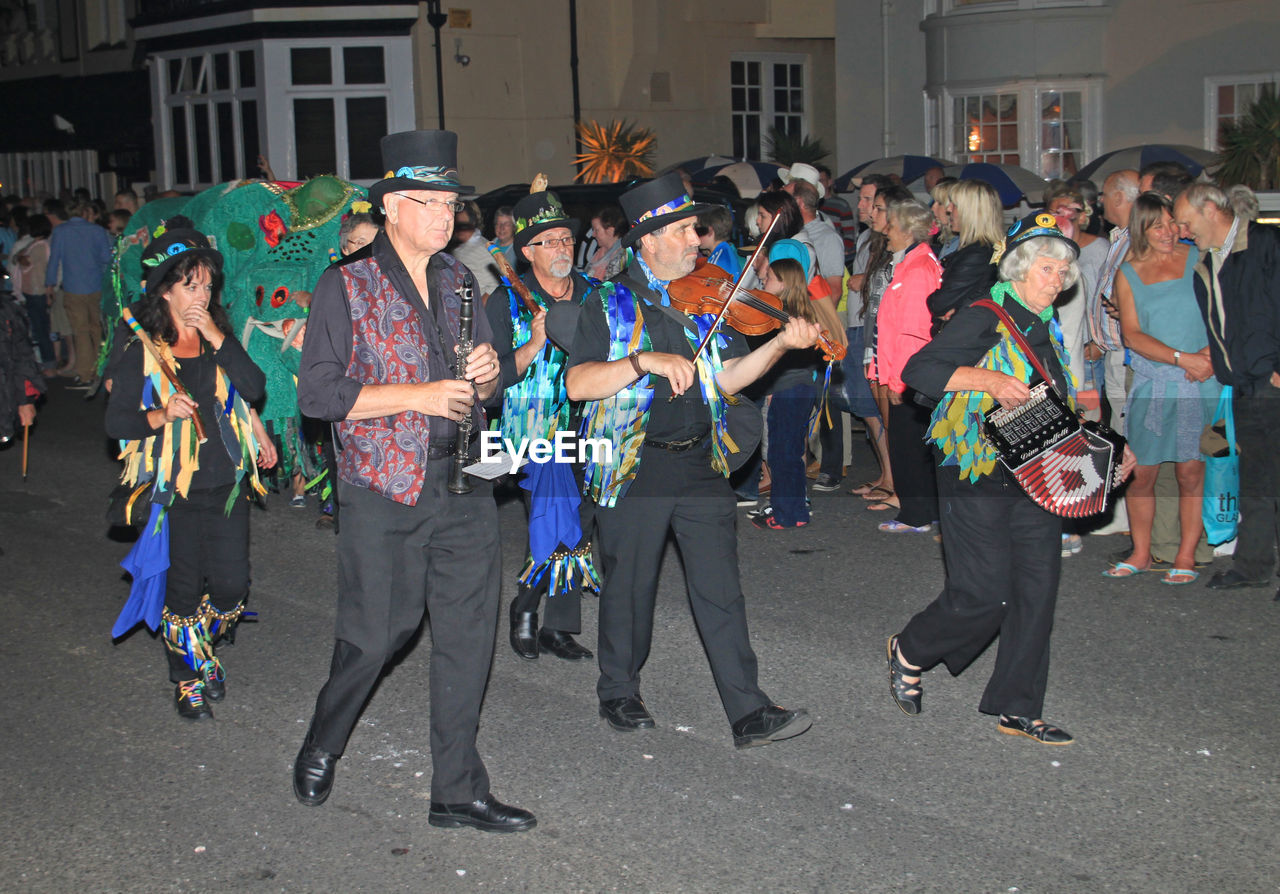 GROUP OF PEOPLE ON STREET