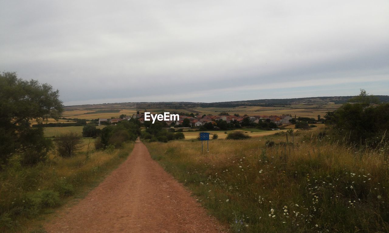 View of road against cloudy sky