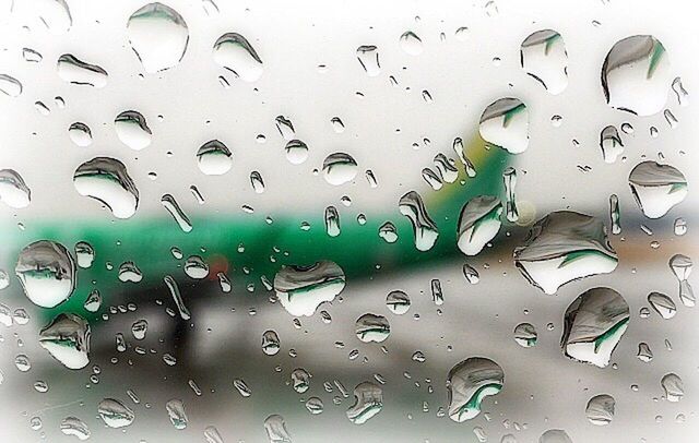 CLOSE-UP OF WATER DROPS ON WINDOW