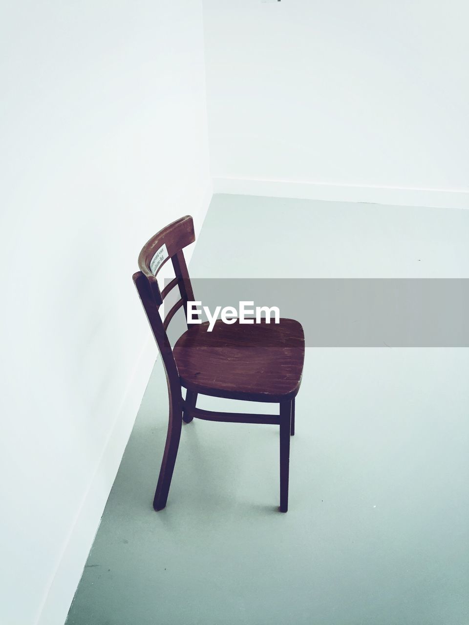 EMPTY CHAIR ON TABLE AT HOME