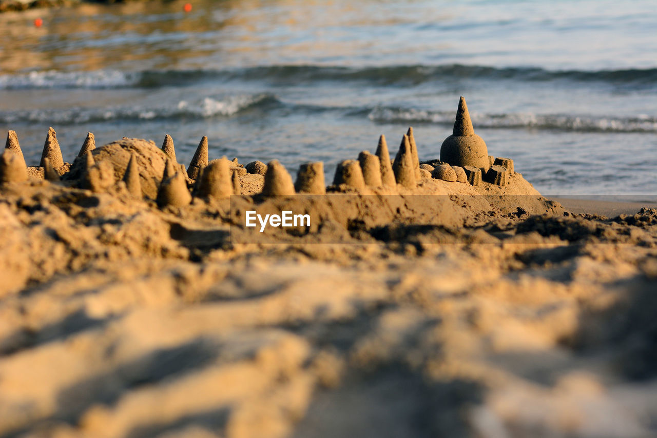 Sand castle, low view, with the sea in the background