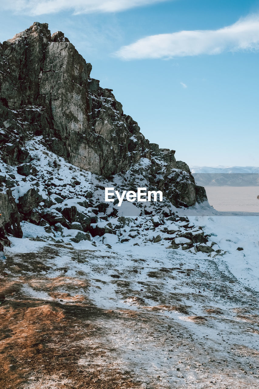 sky, water, sea, scenics - nature, beauty in nature, rock, land, cloud, nature, environment, beach, coast, landscape, mountain, shore, ocean, winter, travel destinations, snow, no people, tranquility, travel, cold temperature, outdoors, tranquil scene, wave, rock formation, coastline, non-urban scene, day, cliff, terrain, tourism, body of water, sports, holiday, motion