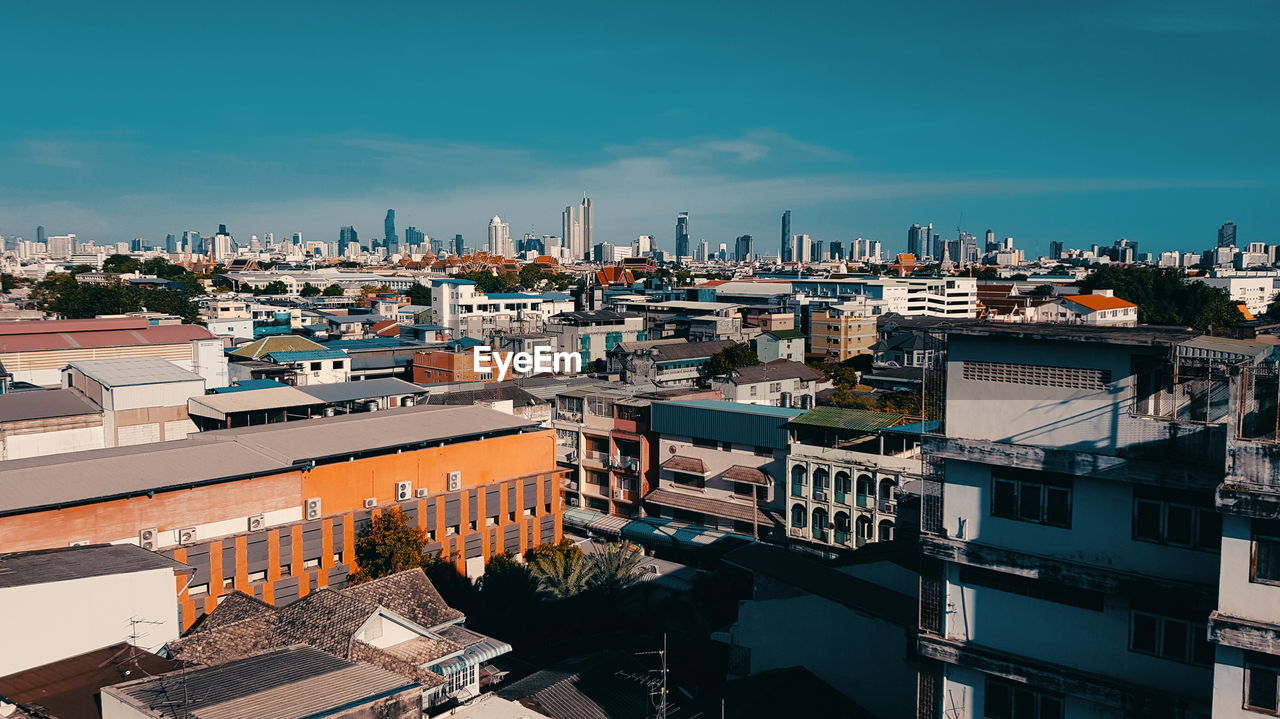 High angle view of buildings in city against sky