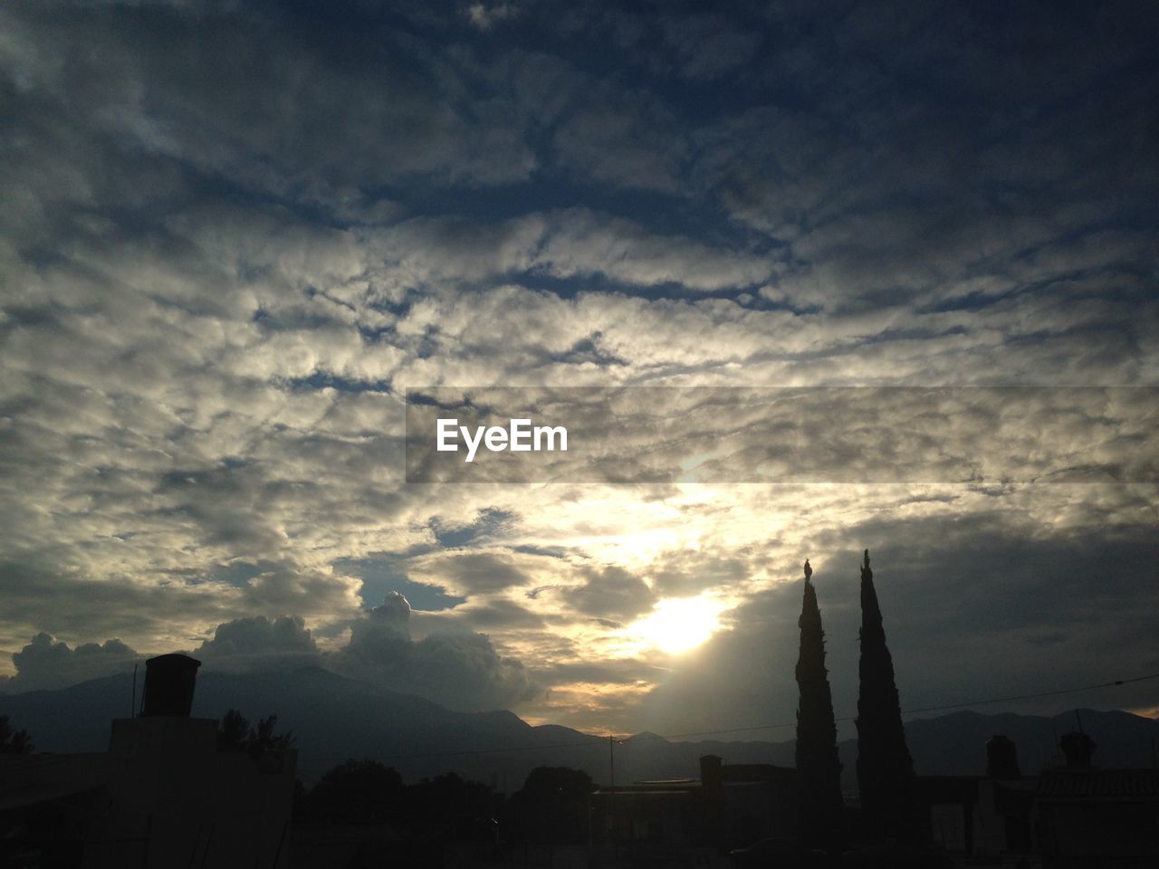 VIEW OF CLOUDY SKY AT SUNSET