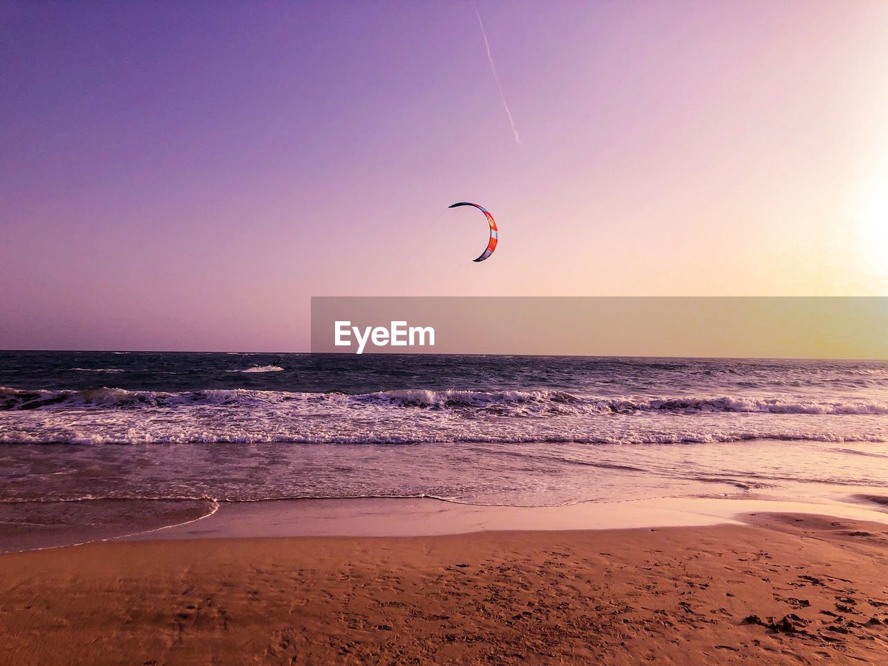 SCENIC VIEW OF BEACH DURING SUNSET