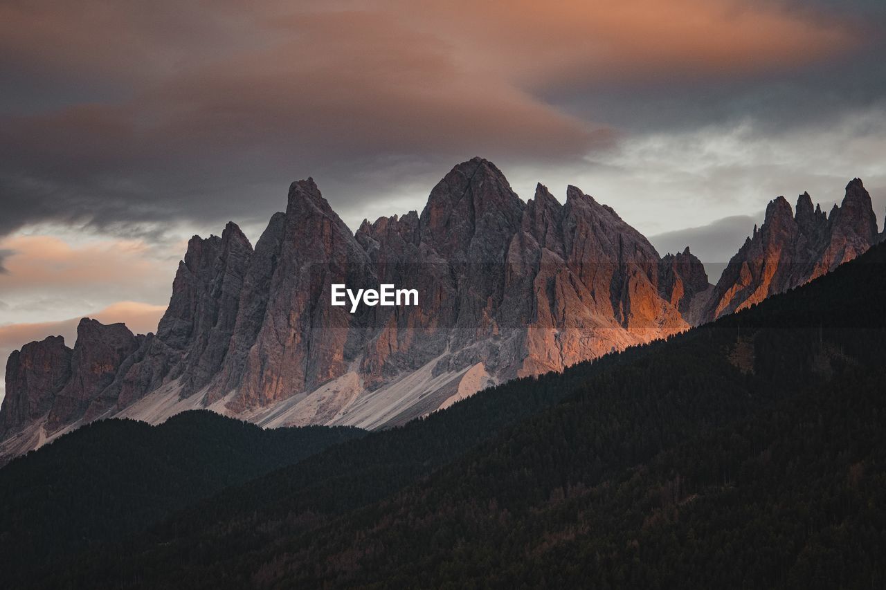 panoramic view of mountain range against sky during sunset