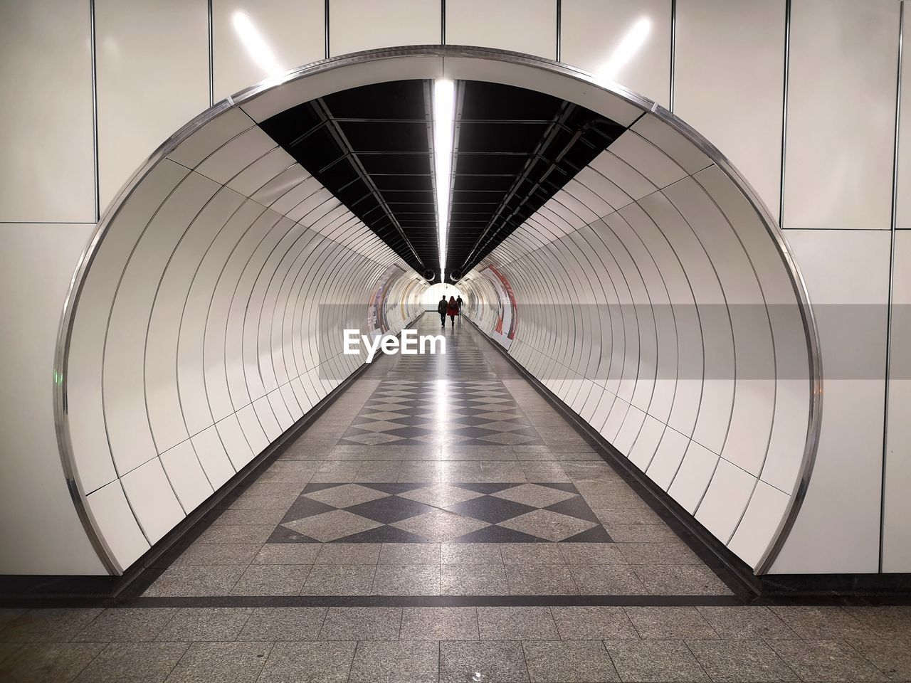 REAR VIEW OF ILLUMINATED SUBWAY STATION