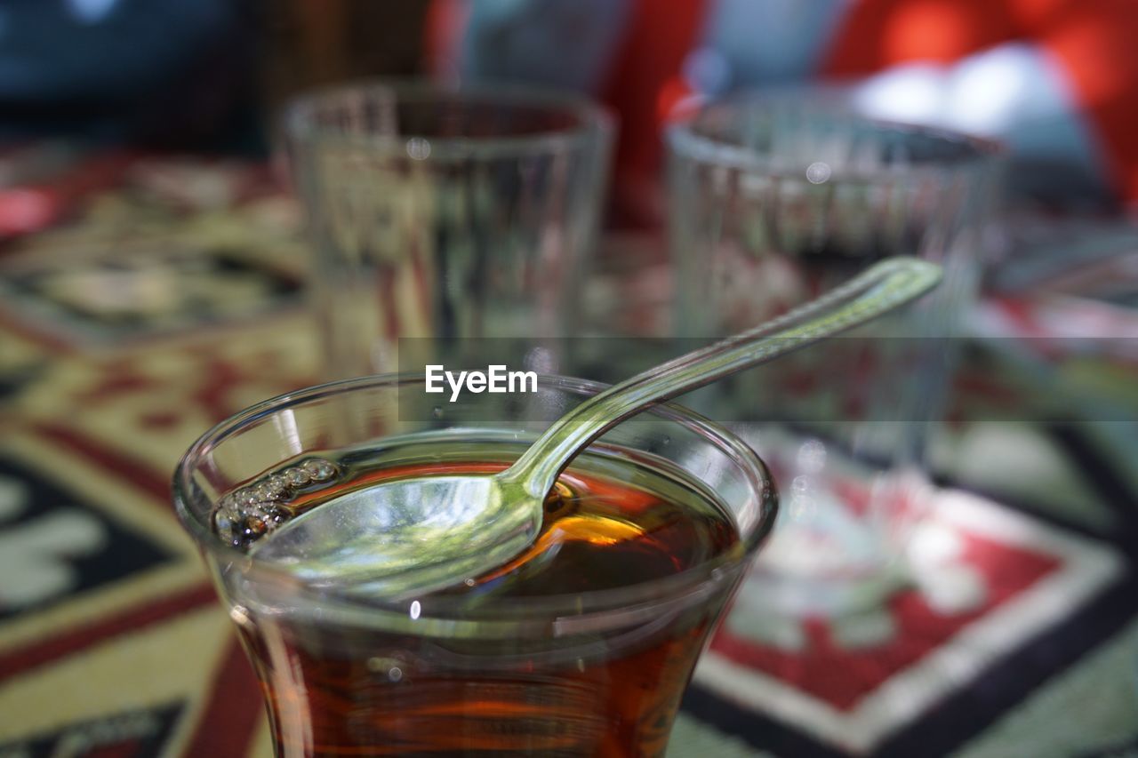 Close-up of drink in drinking glass on table