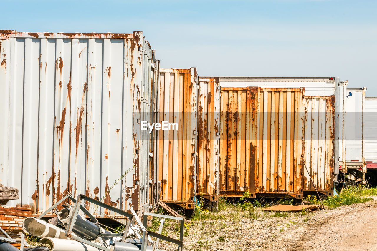 Old rusty industrial freight containers abandoned, background