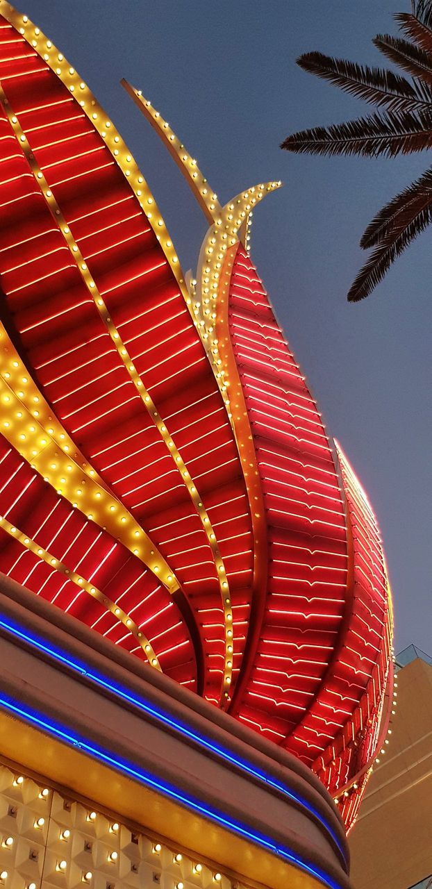 LOW ANGLE VIEW OF ILLUMINATED ROOF OF BUILDING