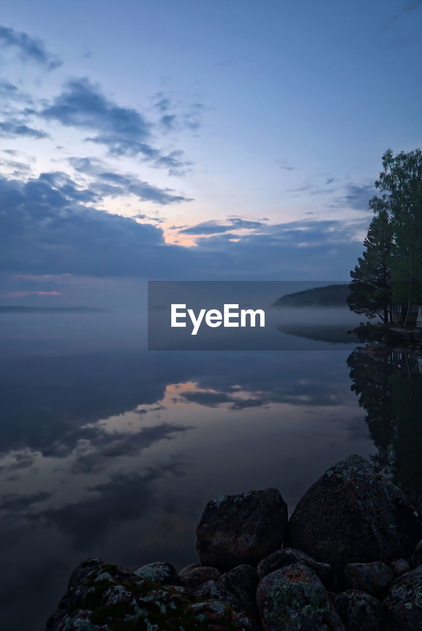 Scenic view of sea against sky at sunset