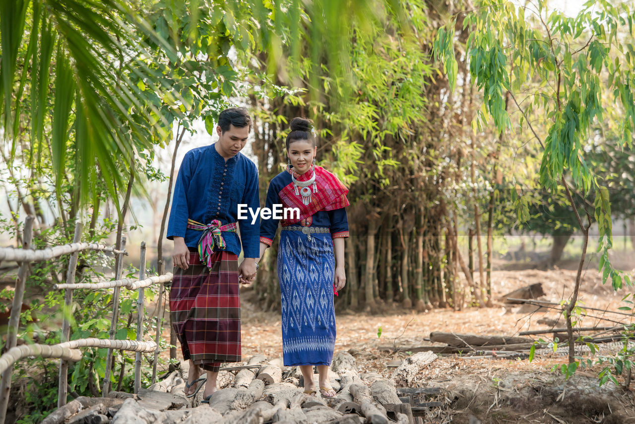 Pre wedding shoot inside garden in thai traditional dress costumes