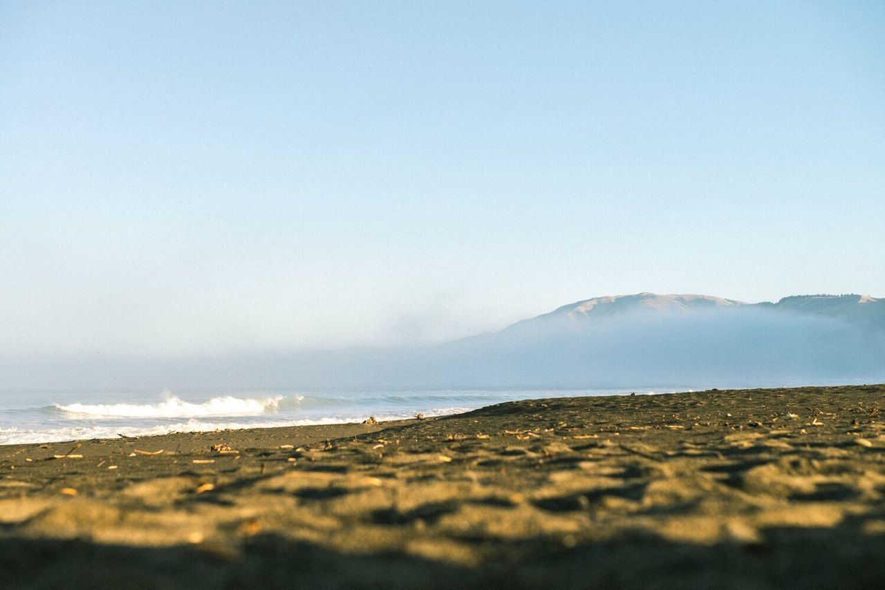 SCENIC VIEW OF SEA AND MOUNTAINS