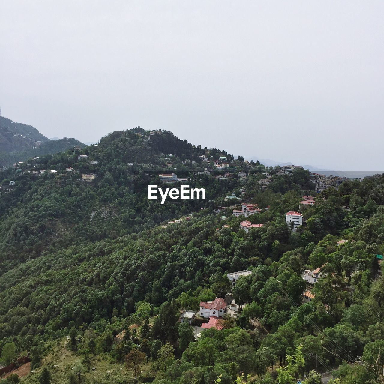 HOUSES ON MOUNTAIN AGAINST CLEAR SKY