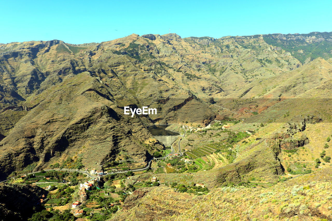 Scenic view of mountains against clear sky