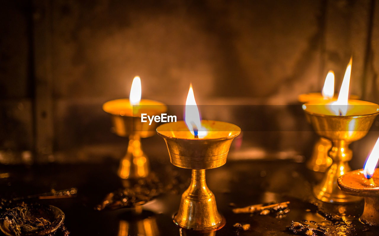 close-up of illuminated candles