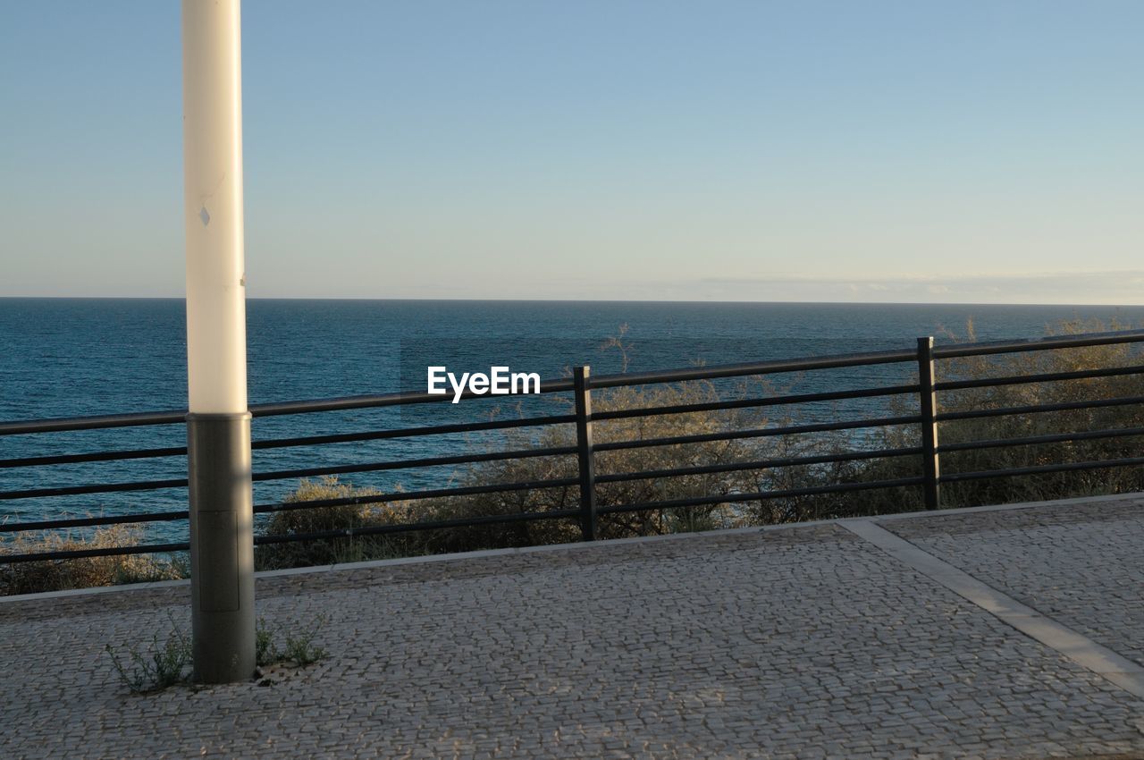 Scenic view of sea against clear blue sky