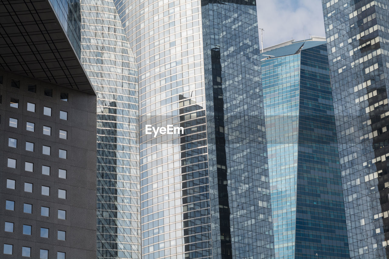 Low angle view of skyscrapers against sky