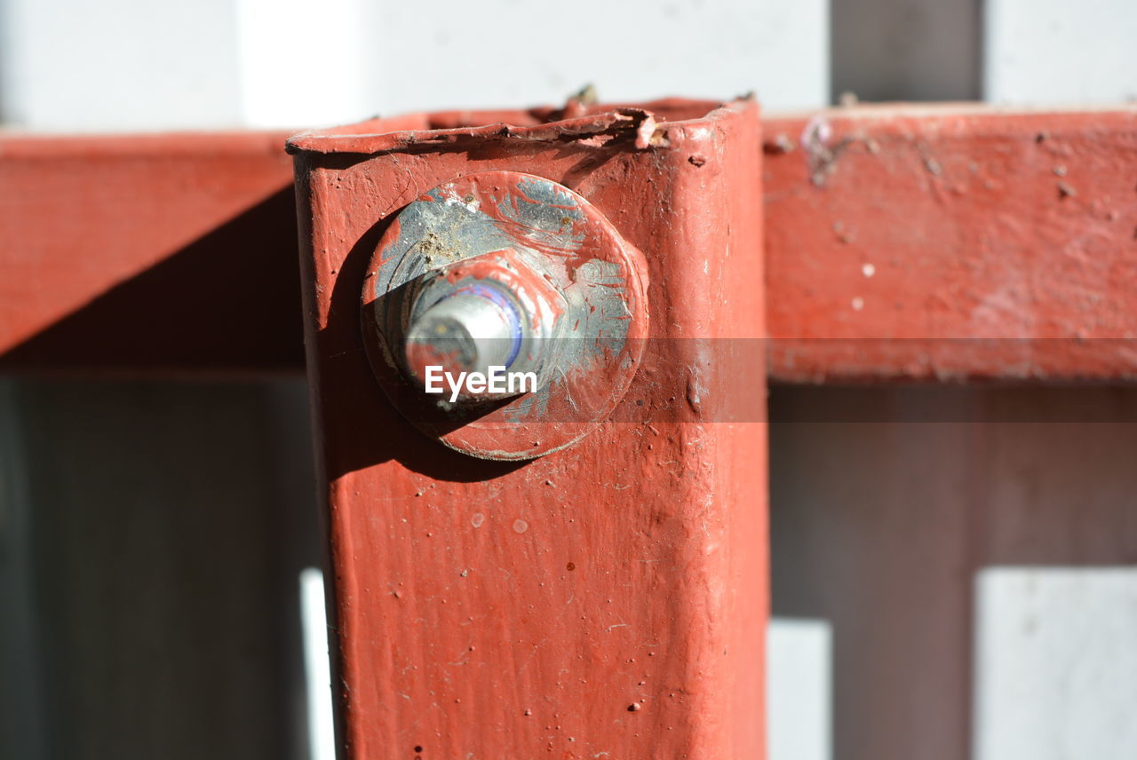 Close-up of rusty metal against wall