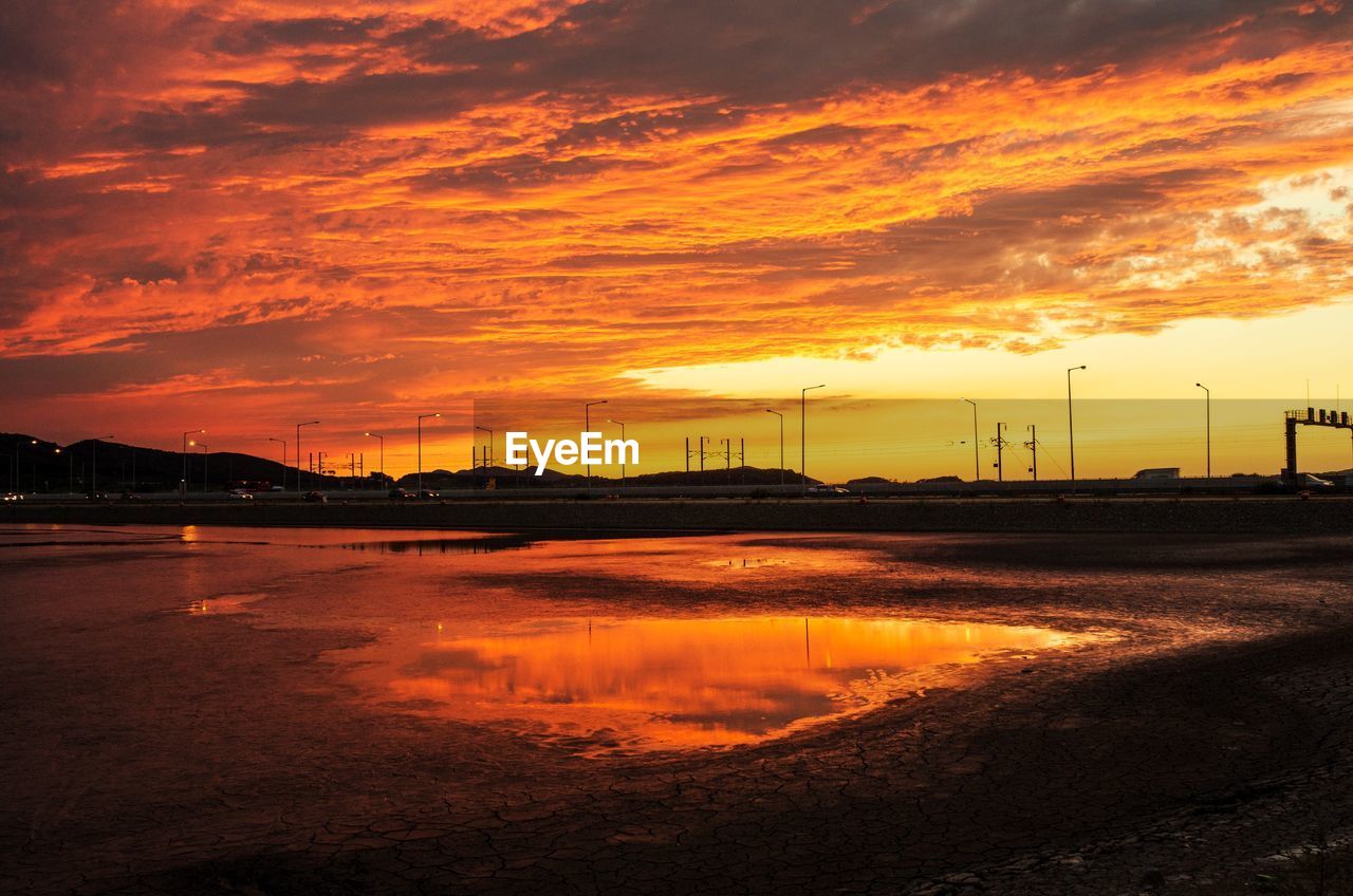 Scenic view of sea against romantic sky at sunset