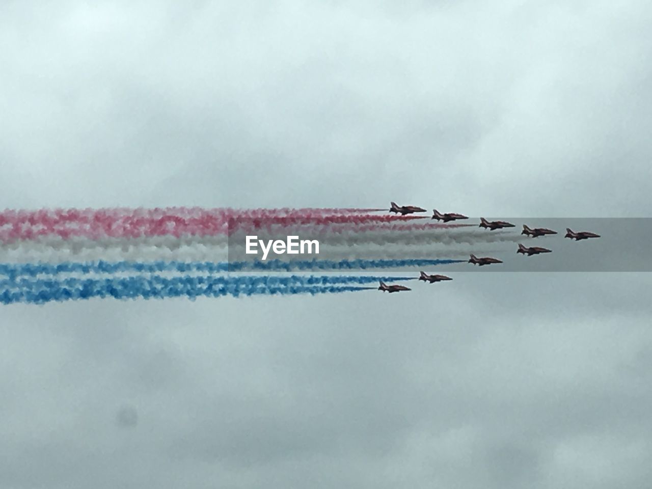 Low angle view of air show against sky