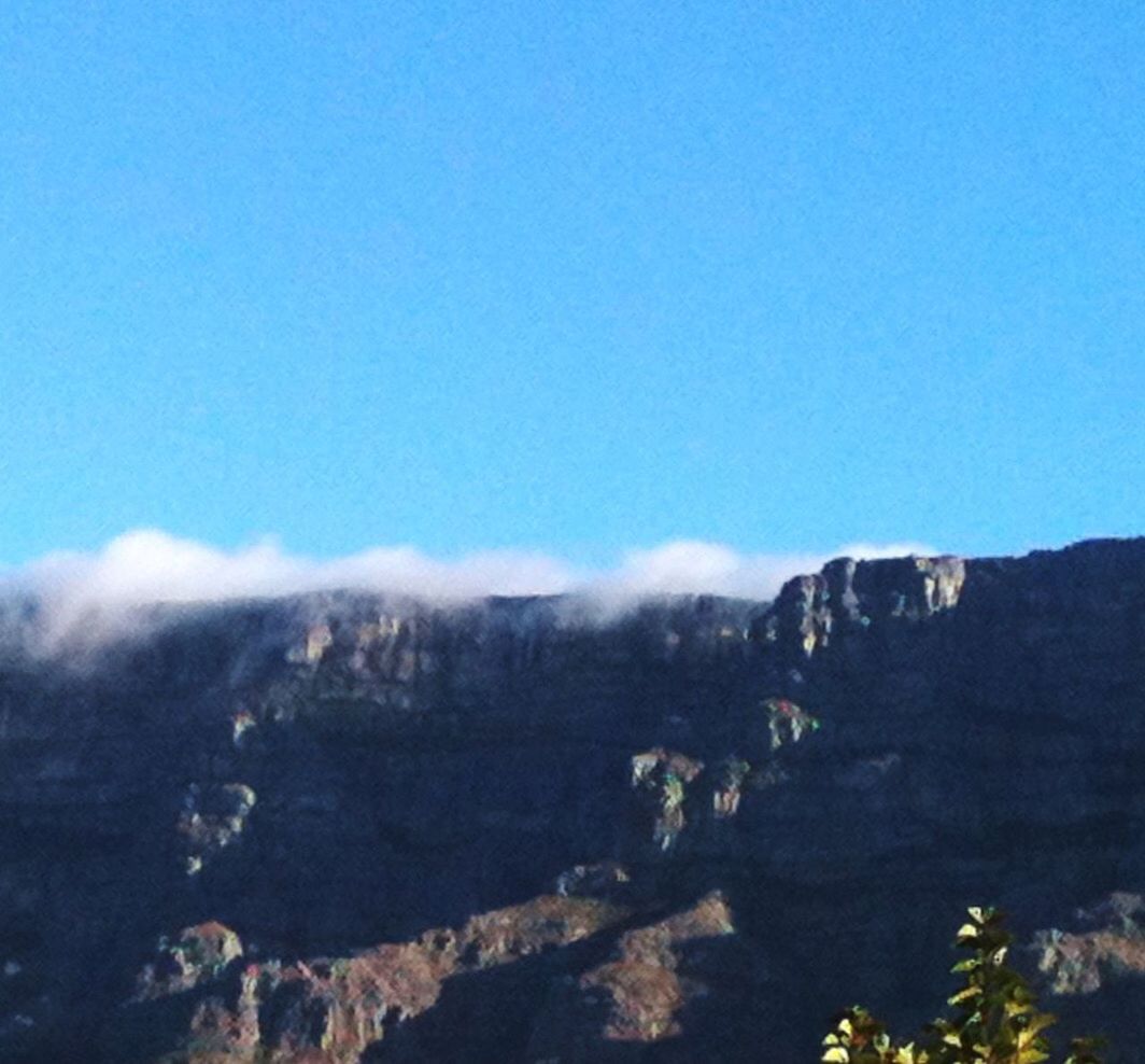 SNOW COVERED MOUNTAINS AGAINST CLEAR SKY