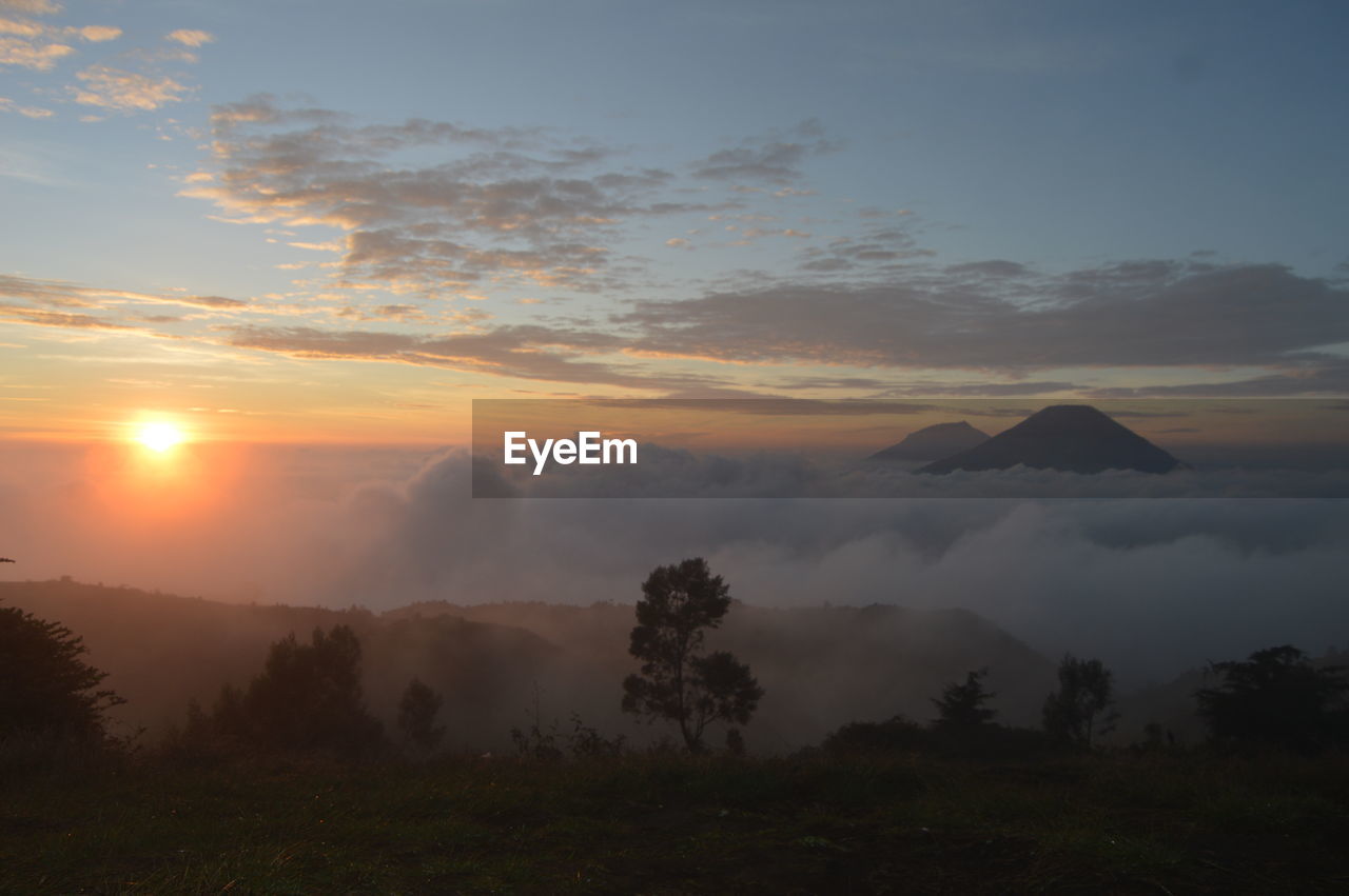 Scenic view of landscape against sky during sunset