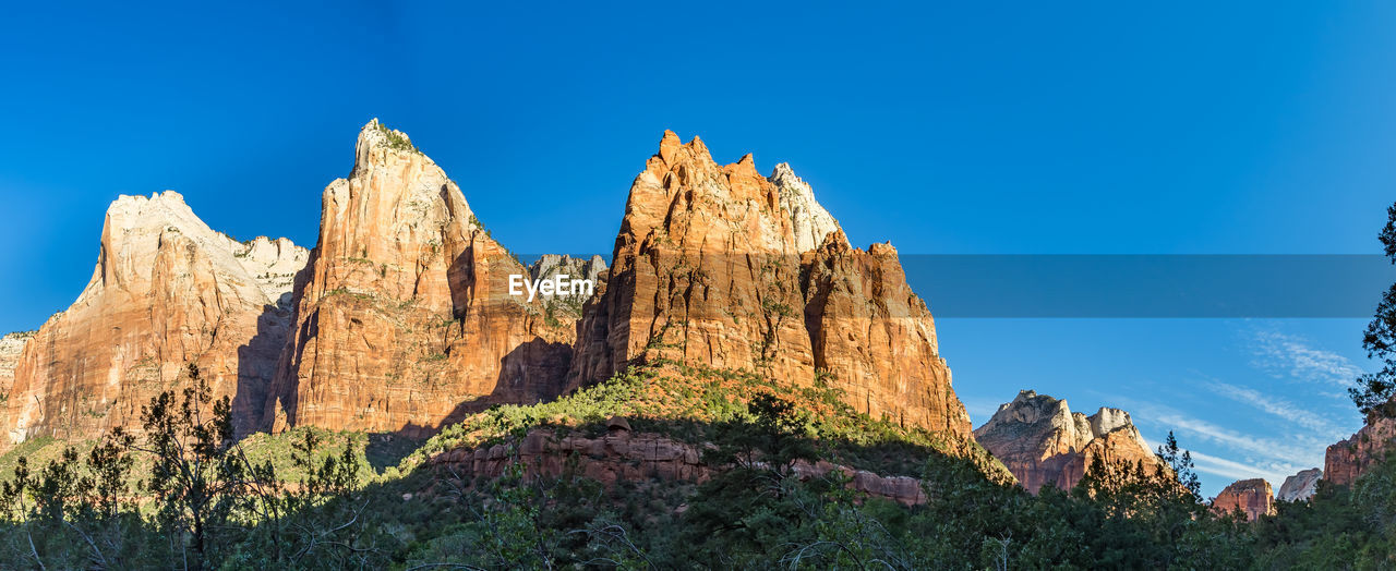 View of rock formations against blue sky