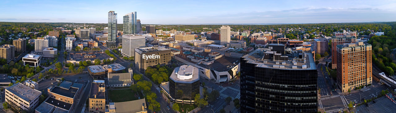 HIGH ANGLE VIEW OF MODERN BUILDINGS AGAINST SKY