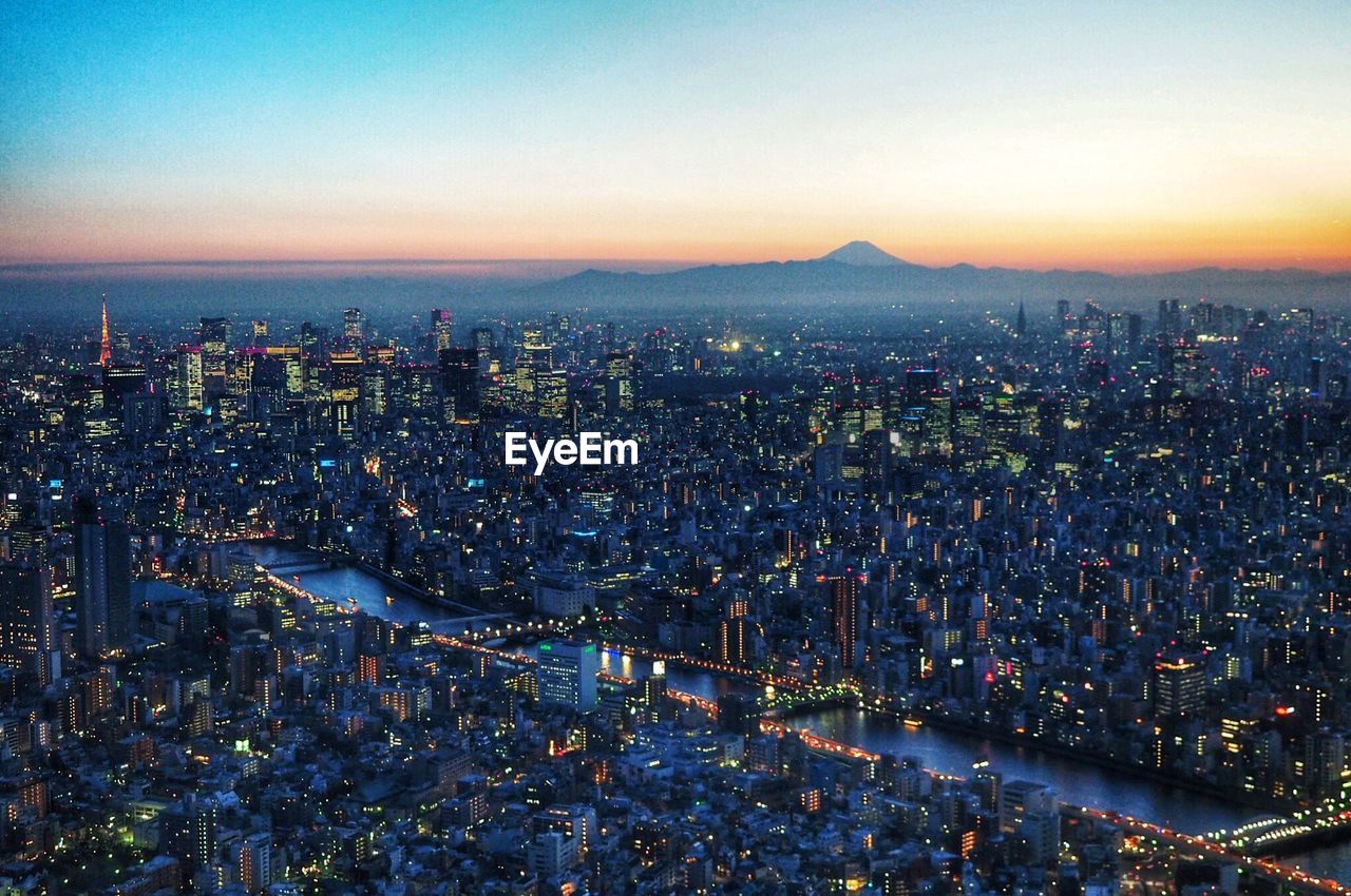 Aerial view of city during sunset