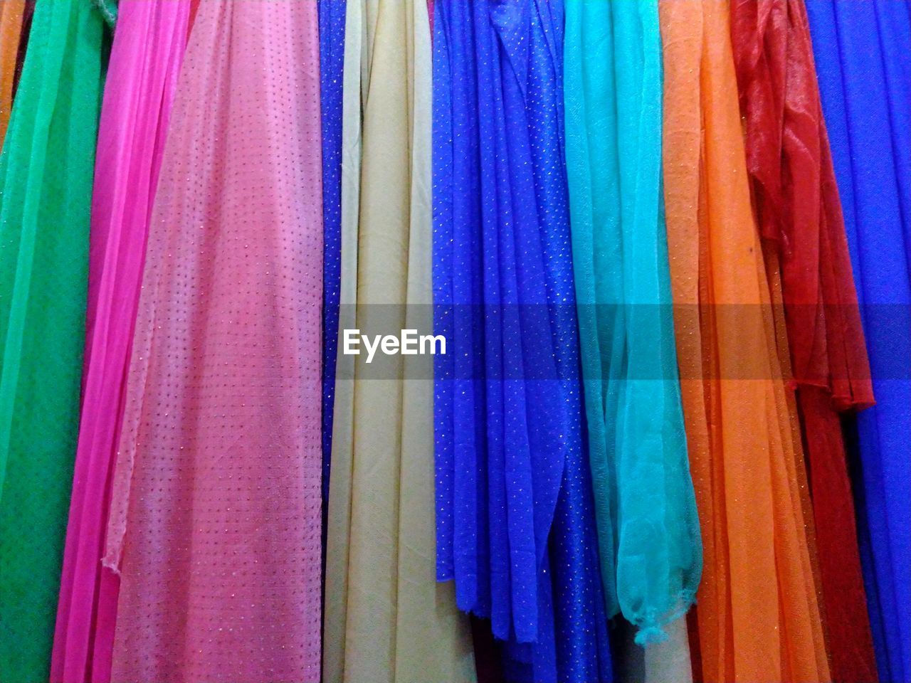 Full frame shot of colorful fabrics for sale in store