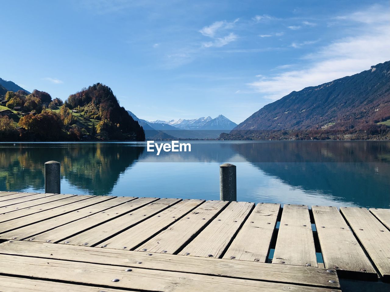 Pier over lake against sky