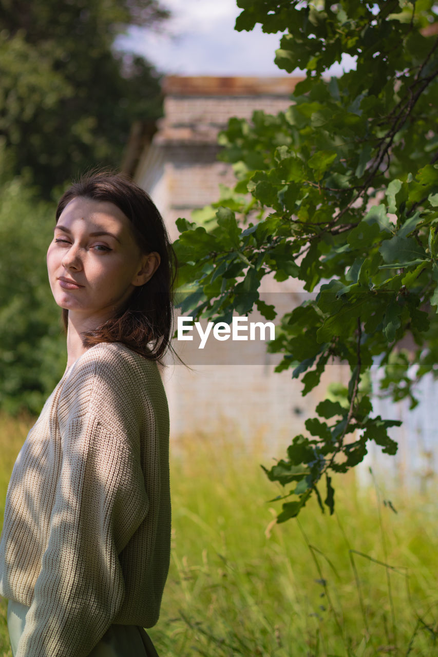 Young woman looking away outdoors