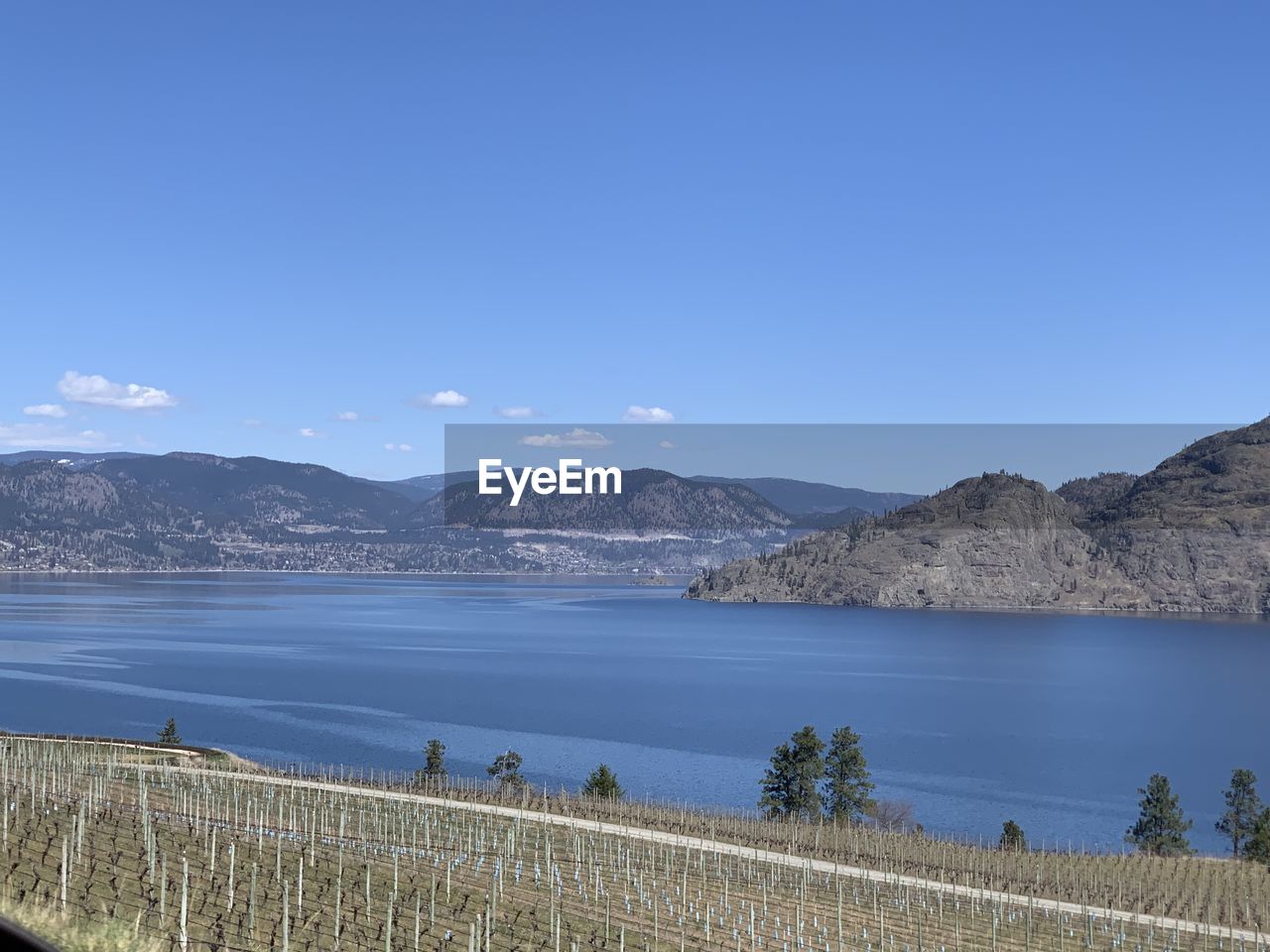 Scenic view of lake against blue sky